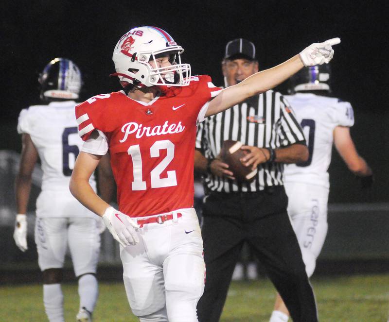 Ottawa's Conner Price signals first down during the home opener against Plano at King Field on Friday, Aug. 26, 2022.