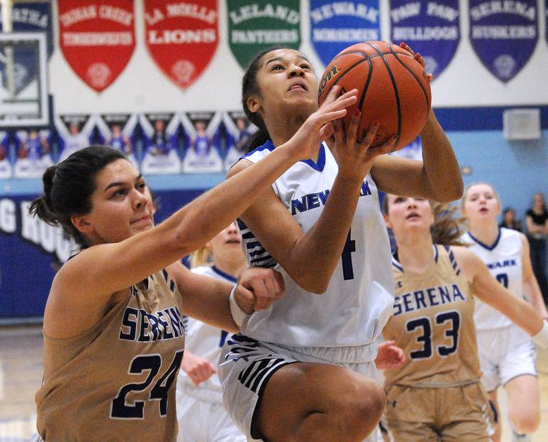 Newark's Kiara Wesseh (4) takes a shot past Serena's Paisley Twait (24) during the Little Ten Girls' Basketball Tournament Championship on Friday, Jan. 20, 2023.