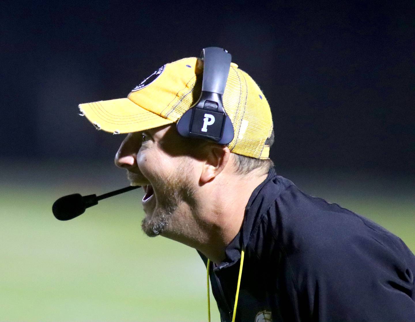 Jacobs’ Head Coach Brian Zimmerman is all smiles as the Golden Eagles build up a first-half lead against Dundee-Crown in varsity football  at Jacobs High School in Algonquin on Friday, Oct. 10, 2025.