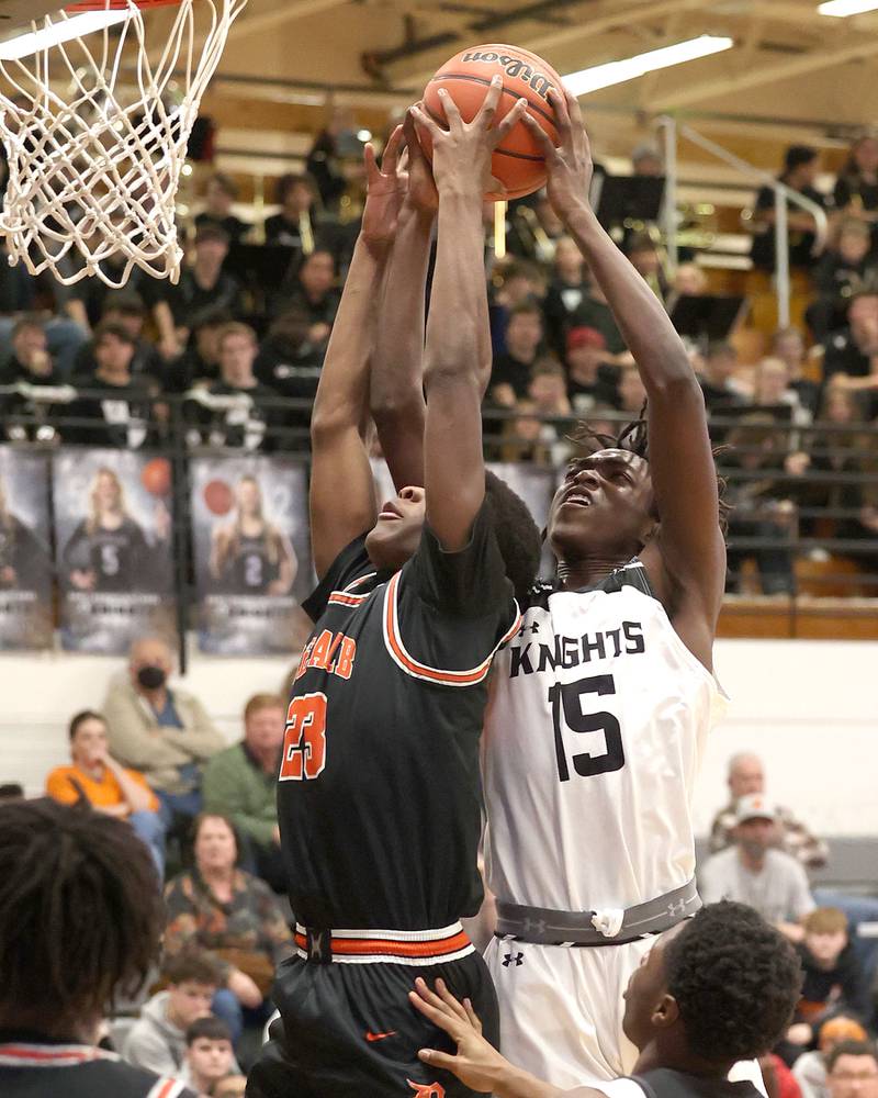 DeKalb's Davon Grant and Kaneland's Freddy Hassan go after a rebound during their game Tuesday, Jan. 24, 2023, at Kaneland High School.