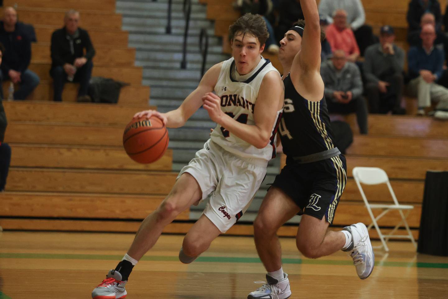 Conant’s Bradley Biedke makes a move along the baseline against Lemont in the Jack Tosh Holiday Classic at York High School on December 27th.