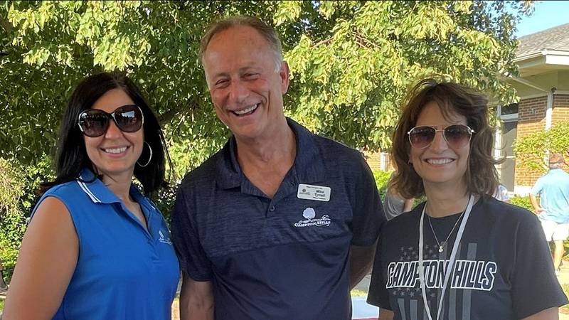 Campton Hills Administrative Assistant Dorothea Stipetic (left) with former village president Michael Tyrrell and current Village Administrator Denise Burchard at last year’s Night Out Against Crime event in the village. Stipetic was put on paid administrative leave this week following an incident with a village contractor. Officials said she will be back on Monday.