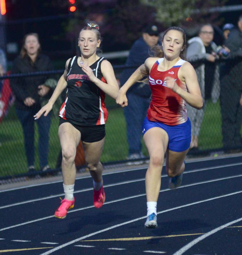 Forreston-Polo's Autum Pritchard (left) and Oregon's Hadley Lutz run the curve in the 200 meters at the 1A Winnebago Sectional on Friday, May 12.