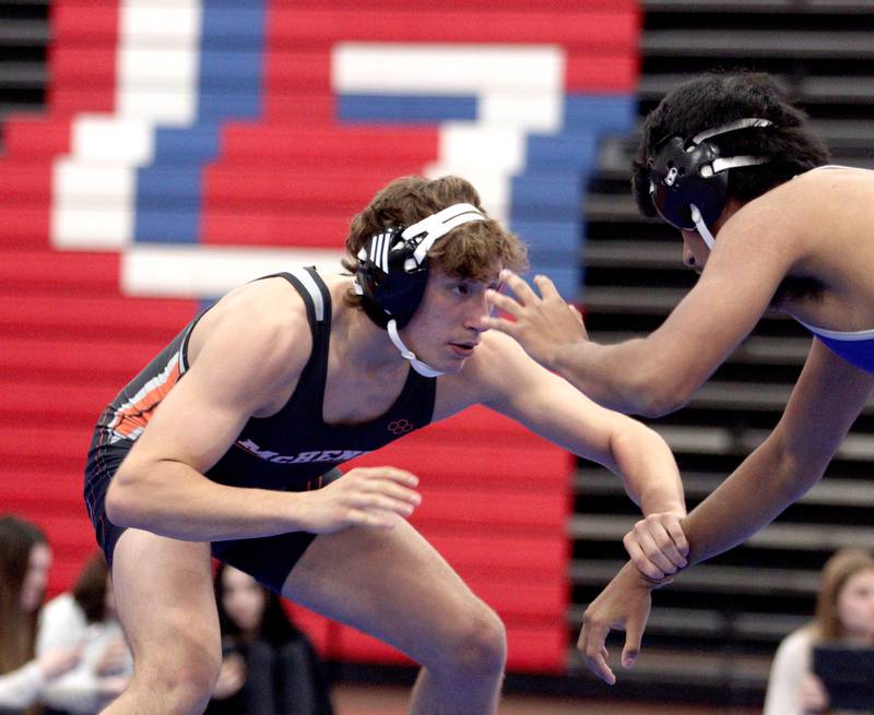 McHenry’s Pedro Jimenez, left, battles Dundee-Crown’s Daniel Gutierrez in a 150-pound bout in varsity wrestling at Carpentersville Thursday night.