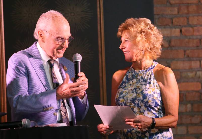 LeeAnn Meinhold daughter of legendary Henry-Senachwine baseball coach Bob Newell, speaks with emcee Lanny Slevin during the 2025 Shaw Media Illinois Valley Sports Hall of Fame at the Auditorium Ballroom in La Salle.