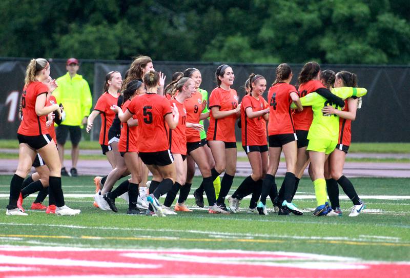Crystal Lake Central players celebrate their win over Triad in the Class 2A state championship game at North Central College in Naperville on Saturday, June 1, 2024.