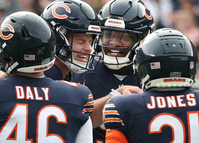 Chicago Bears punter Tory Taylor (second from left) celebrates with teammates after his 66 yard punt pinned the Los Angeles Rams at their own 8-yard line during their game Sunday, Sept. 29, 2024, at Soldier Field in Chicago.