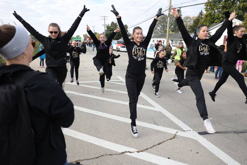 Members of the Leap of Faith Arts Ministry Dance Team practice before the start of the 70th Annual Plainfield Homecoming Parade. Saturday, Oct. 8, 2022, in Plainfield.