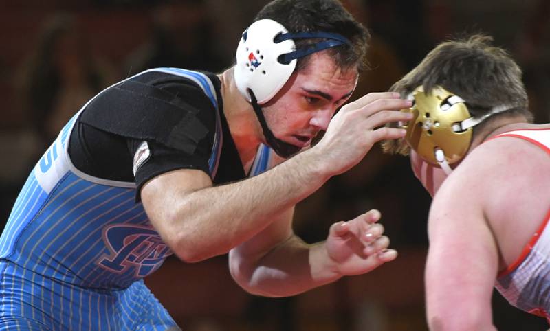 Newman's Matthew Clemen (left) makes a move on Oregon's jacksyn Windham during their 215-pound bout at the Oregon Quad meet on Saturday, Jan. 17, 2026 at the Blackhawk Center in Oregon.