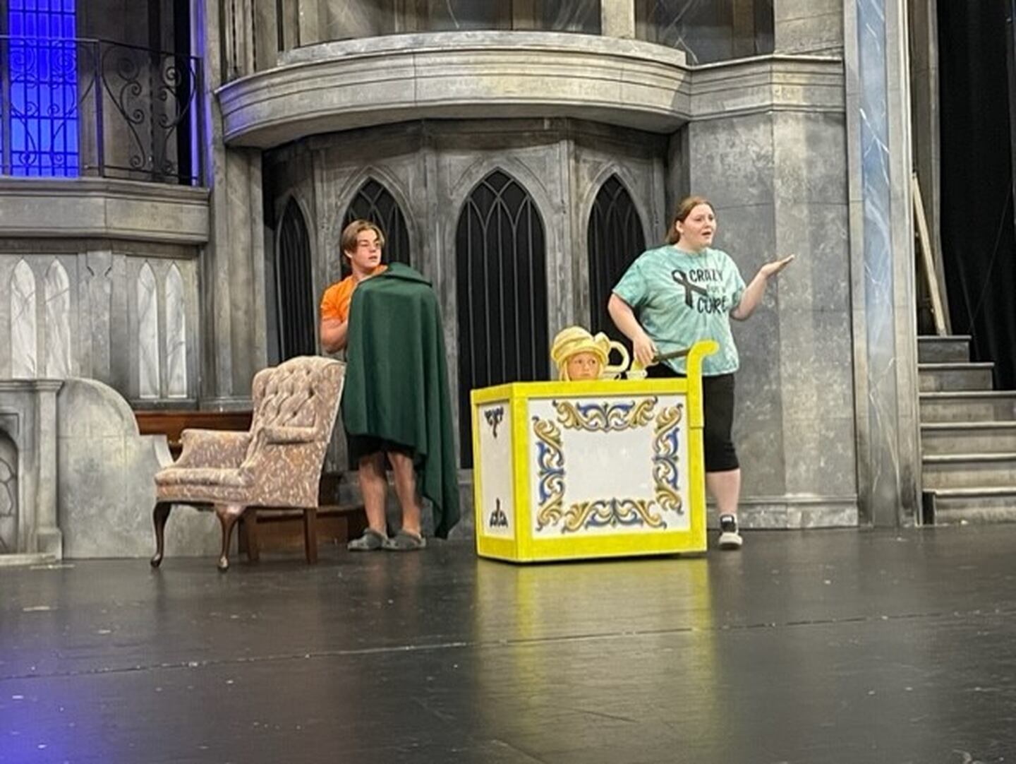 Tyler Zepezauer (Cogsworth), Anna Hutchison (Mrs. Potts) and Chloe Stumpenhorst (Chip) practice for the upcoming performance of the "Beauty and the Beast".