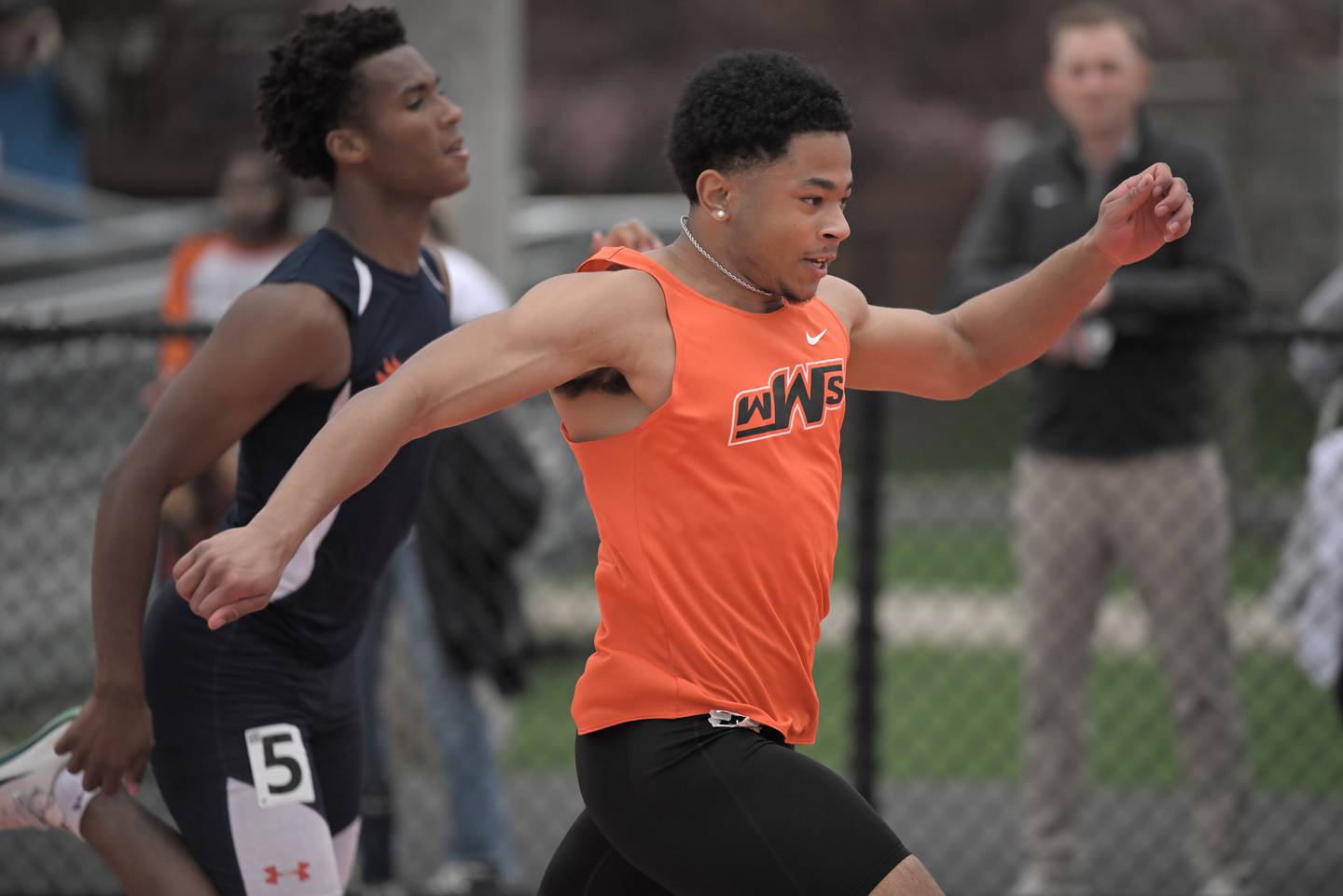 Aden Applewhite of Wheaton Warrenville South wins the 100-meter dash at the Naperville North Gus Scott boys and girls track and field invitational on Friday, Apr. 17, 2026 in Naperville.