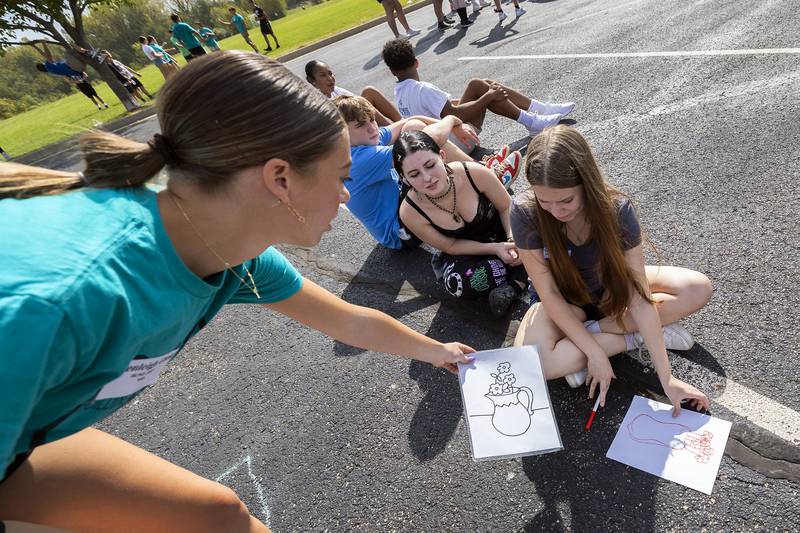 BLIND leader Brenleigh Cook of Newman High School runs a group of freshmen through an exercise Thursday, Sept. 19, 2024. Building Lasting Impression that Never Die  is meant to help students be more understanding and thoughtful.