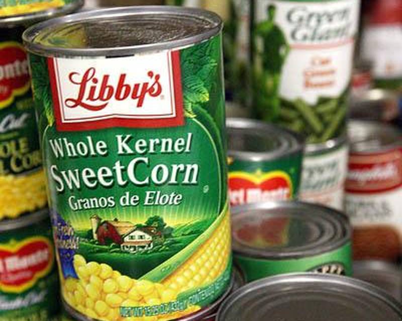 Stacks of sorted canned goods sit Friday afternoon before they are placed in Thanksgiving baskets by volunteers at The Salvation Army food pantry on Grove Street in DeKalb. Chronicle photo KATE WEBER