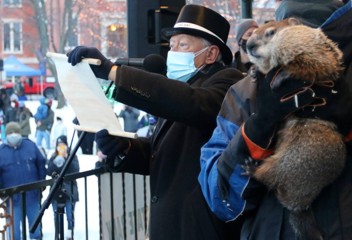 Former Mayor Brian Sager announces to the crowd that Woodstock Willie woke up and did not see his shadow, symbolizing an early spring, during the annual Woodstock Groundhog Days Prognostication on the historic Woodstock Square on Tuesday, Feb. 2, 2021, in Woodstock.