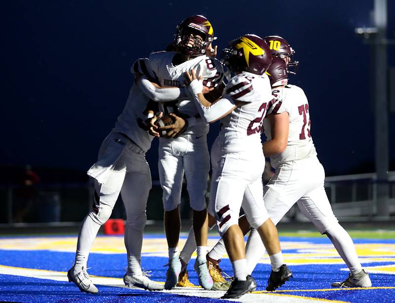 Richmond-Burton's Joseph Larsen is mugged by his teammates after returning a interception for a touchdown during a Kishwaukee River Conference football game against Johnsburg on Friday, Sept. 12, 2025, at Johnsburg High School.