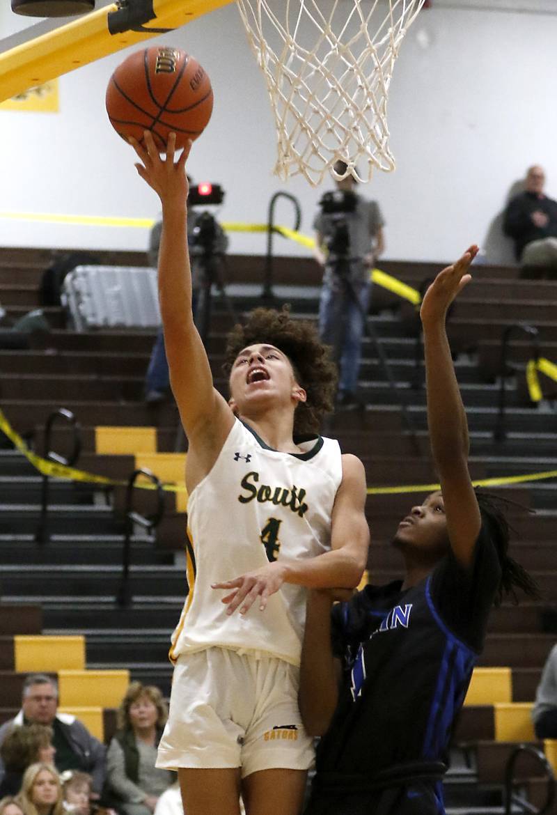 Crystal Lake South's Anthony Demirov is founded by Larkin’s Joshua Hibbett during a Hinkle Holiday Classic basketball game Wednesday, Dec. 28, 2022, at Jacobs High School in Algonquin.
