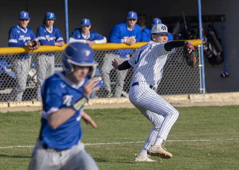 Newman’s Drake Cole throws to first for an out against Princeton Monday, April 6, 2026.