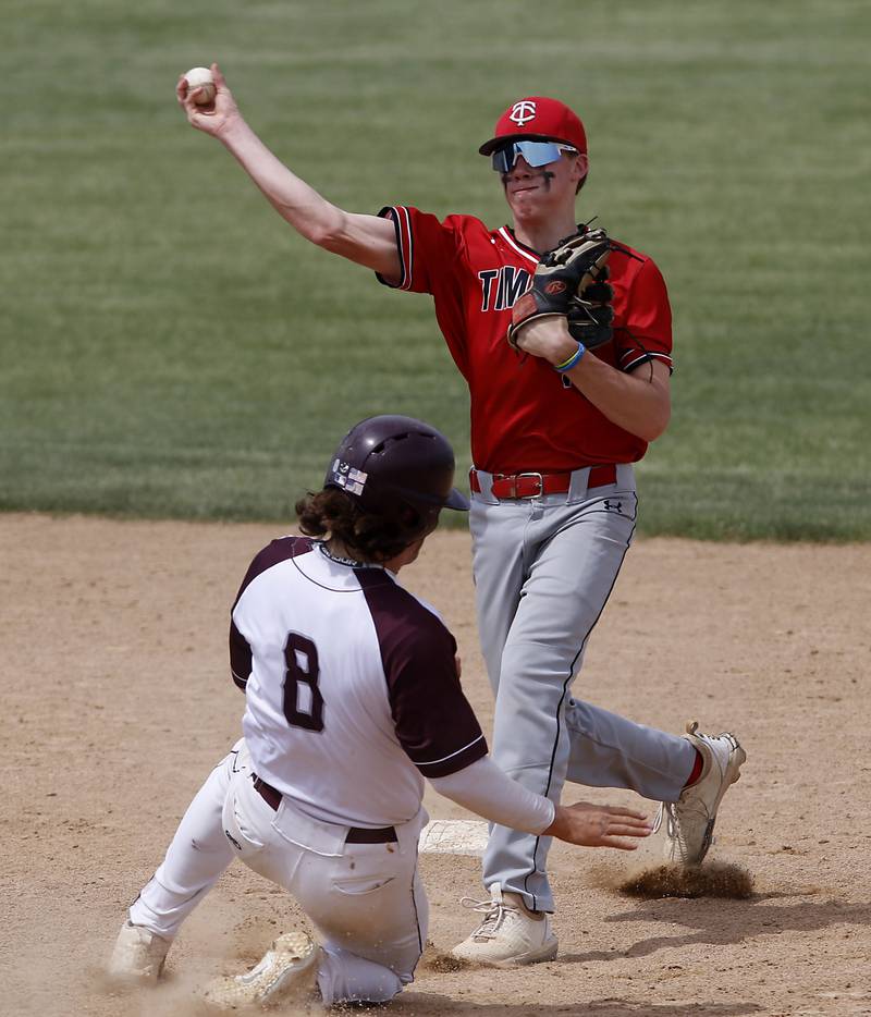 Richmon-Burton’s Brock Wood tries to break up a double play at second base as Timothy Christian’s Fletcher Roemmich throws the ball toe first during a IHSA Class 2A supersectional baseball game between Richmond-Burton and Timothy Christian at the Rockford Rivets Stadium in Rockford.