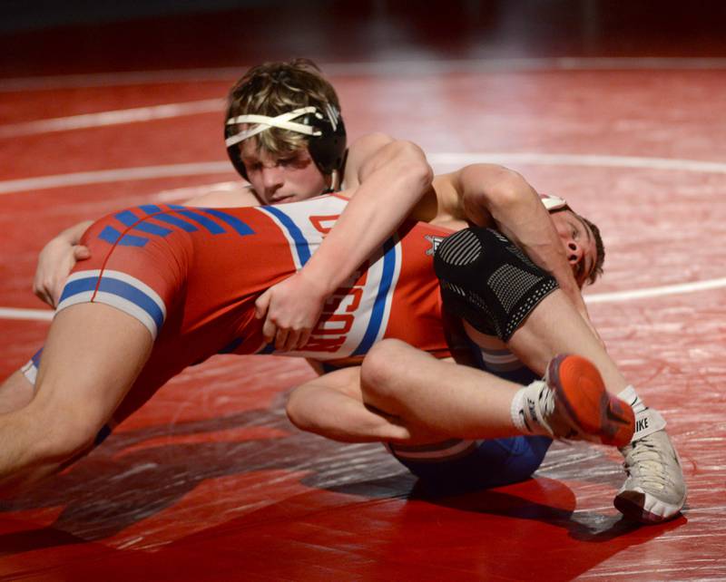 Oregon's Leyton Kenney is held by Newman's Timothy Plote during their 165 pound match at the 1A team sectional held Tuesday, Feb. 25, 2025 in the Blackhawk Center in Oregon.