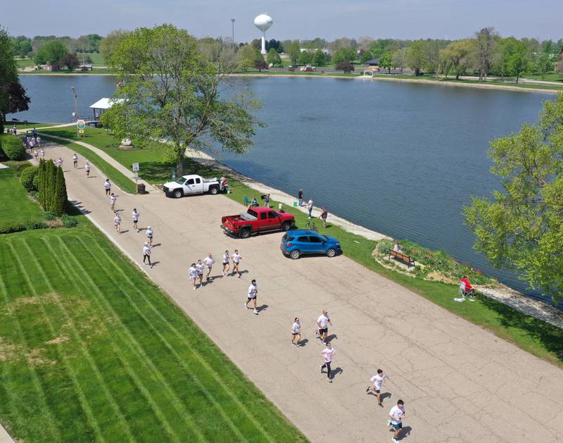 Runners race around Lake Mendota during the Color Fun Run on Sunday, April 26, 2026 in Mendota.