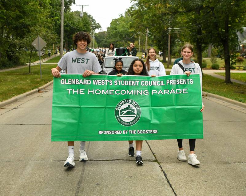 Glenbard West Student council members lead the homecoming parade on Saturday Sept. 28, 2024, that went down Main Street and ended at Glenbard West High School.