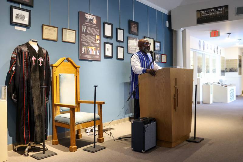 Rev. K. Edward Copeland, son of the late Kankakee civil rights leader Rev. William Copeland, gives a speech surrounded by items from his father's life during the opening of the exhibit 'Called to Kankakee: The Life and Legacy of the Rev. William H. Copeland Jr.' at the Kankakee County Museum on Saturday, Feb. 7, 2026.