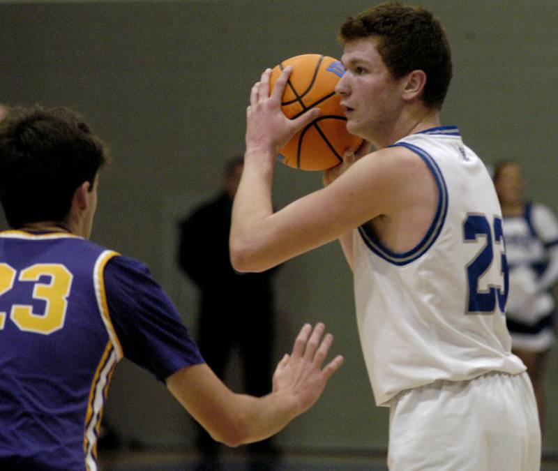 Newman'a John Rowzee looks to pass the ball . The 18-0 Newman Comets beat  the 14-4 Mendota Trojans  67-66 at Newman High School. The game took place on Tuesday, January 13, 2025.