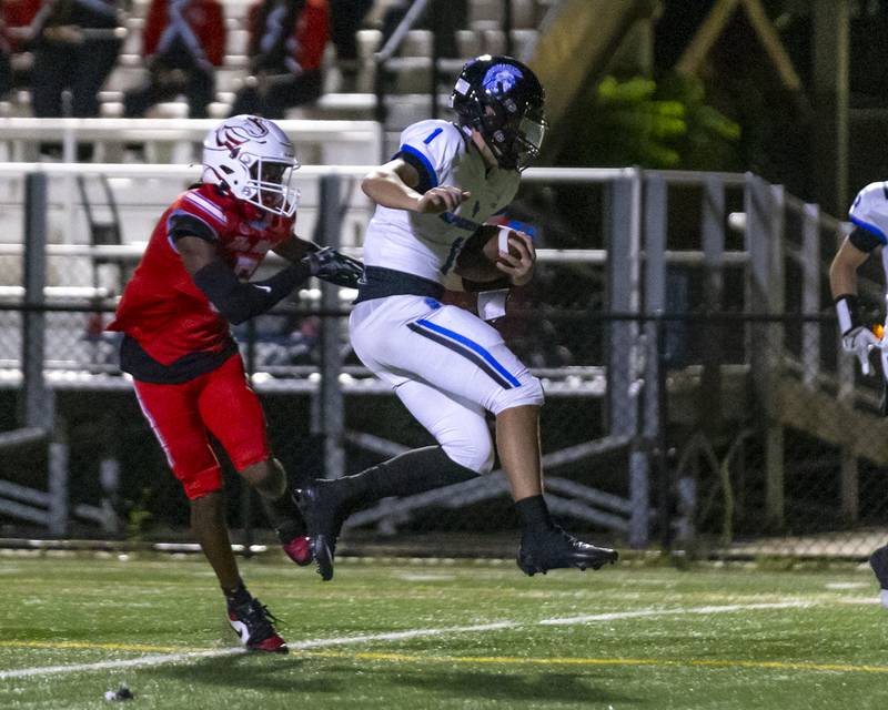 St. Francis's Brock Phillip (1) runs in for a late touchdown during football game between St. Francis at Kenwood Academy on Thursday, Aug 28, 2025  in Chicago.