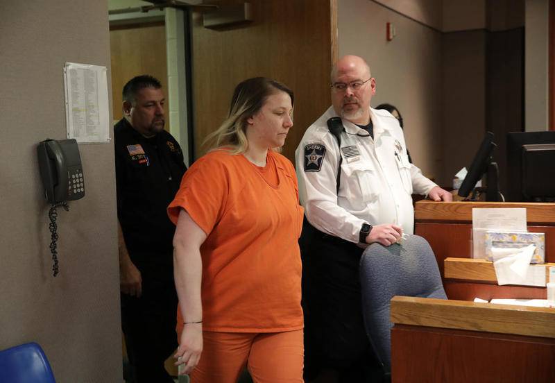 JoAnn Cunningham enters courtroom 302 Feb. 27 for a status hearing with McHenry County Judge Robert Wilbrandt at the McHenry County Courthouse in Woodstock. In December, she plead guilty to killing her 5-year-old son, AJ Freund.