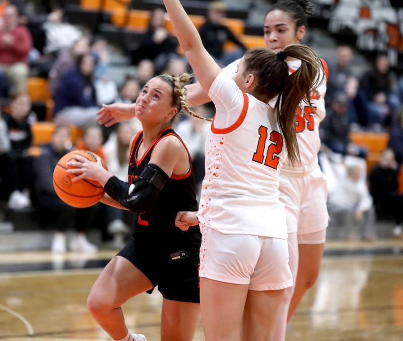 Wheaton Warrenville South's Brooke Ittersagen gets past the St. Charles East defense during a game on Tuesday, Feb. 11, 2025 in St. Charles.