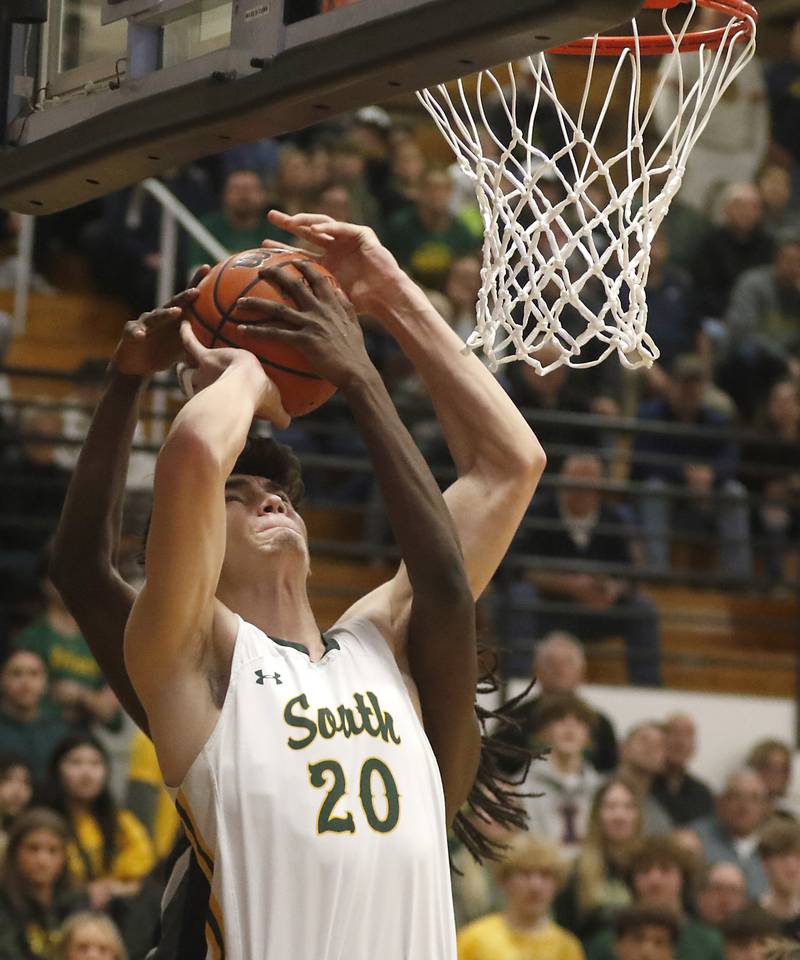 Crystal Lake South's Christopher Regillio is founded by Kaneland's Evan Ross during the IHSA Class 3A Kaneland Boys Basketball Sectional championship game on Friday, March 1, 2024, at Kaneland High School in Maple Park.