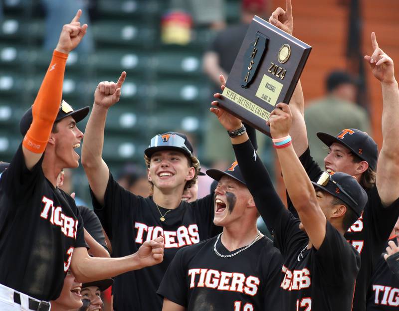 Crystal Lake Central players celebrate a win in supersectional baseball action against DePaul College Prep at Wintrust Field in Schaumburg Monday.
