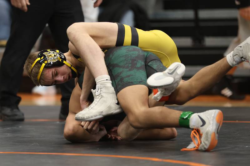 Joliet West’s Nick Murdock-Schey works over Plainfield East’s Brian Tejeda in the SouthWest Prairie Conference 113 pound championship on Saturday, Jan. 24, 2026 in Minooka.