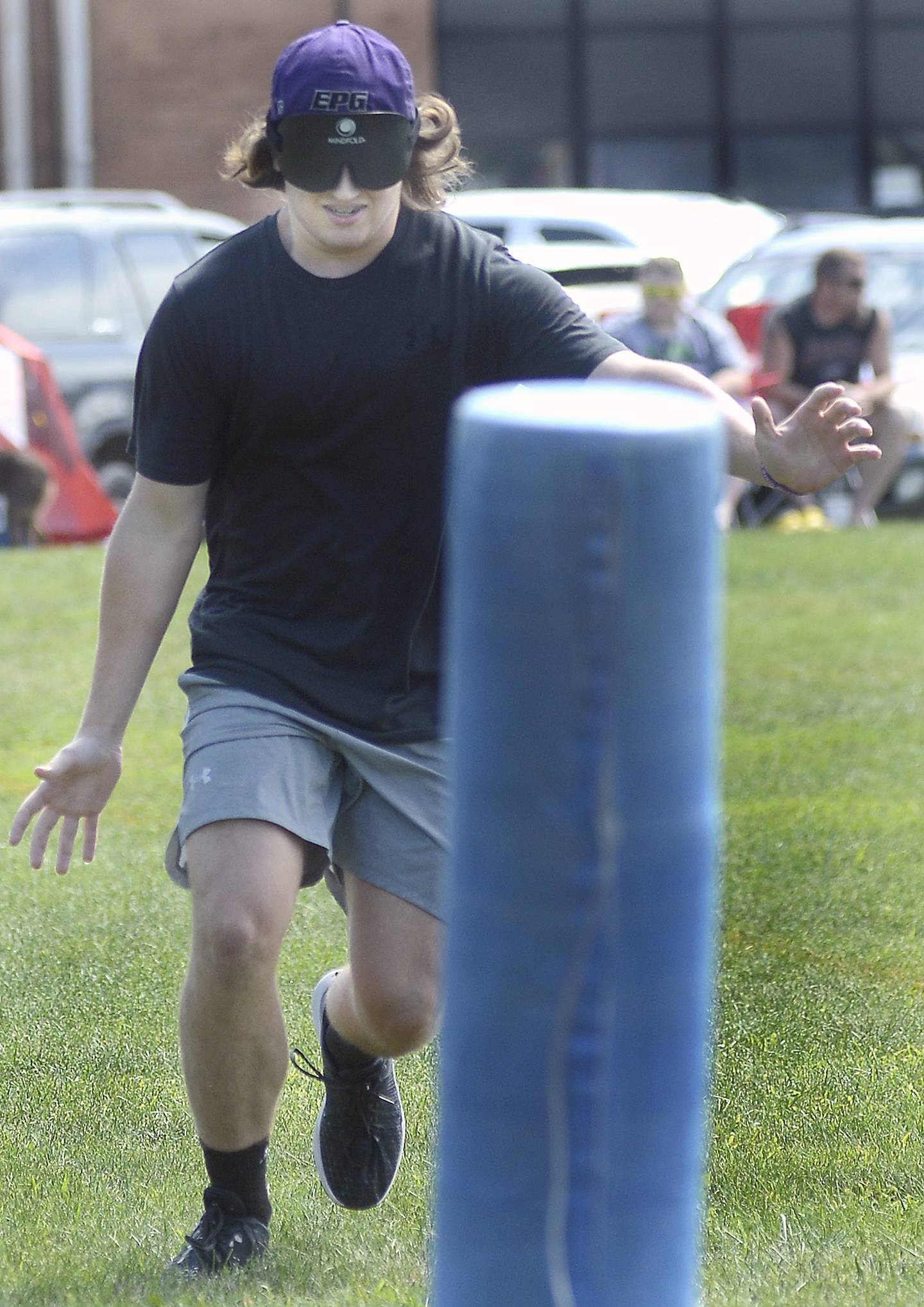 Camden Bressner of the Hardscrabble Lions Club team tries to hear and listen his way to first base Saturday, Aug. 19, 2023, during a beep baseball game against the Chicago Comets at Northlawn School in Streator. A runner who touches the base before the opposing team touches the ball scores a run.