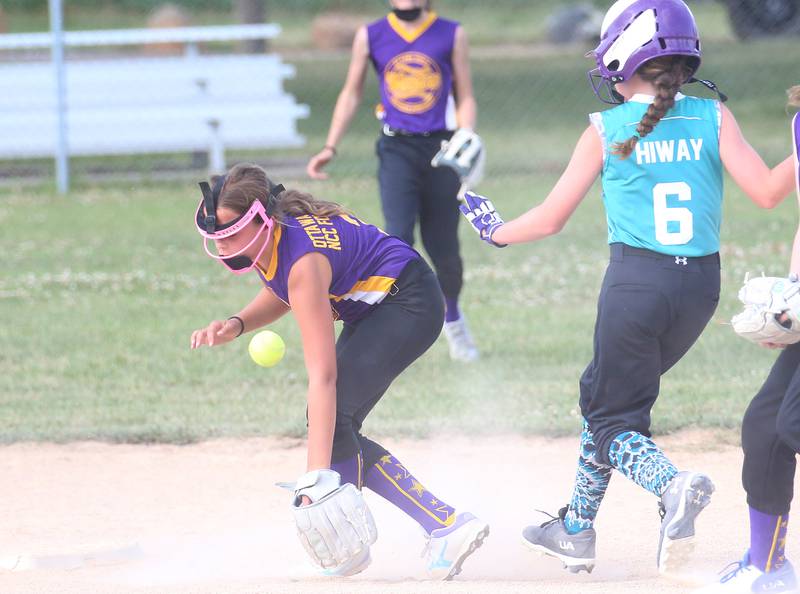 Warriors Rylee Grooms fields a ground ball as Edge's Caitlyn Woods reaches second base during the Ottawa Girls Fastpitch Association 11U City Championship on Wednesday July 2, 2025 at Peck Park in Ottawa.