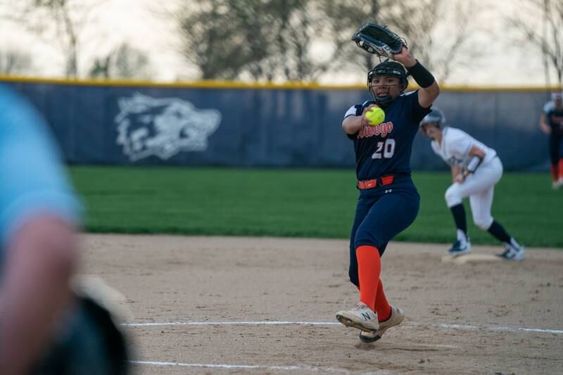 Oswego’s Jaelynn Anthony (20) delivers a pitch against Oswego East during a softball game at Oswego East High School on Wednesday, April 19, 2023.