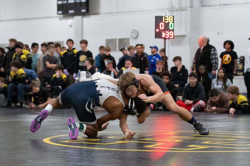 Sandwich's Jaxson Blanchard, right, and Chicago Hope's Chance Woods wrestle in the 138-pound championship match during the Reed-Custer Comet Classic Wrestling Invite on Saturday, Jan 17.