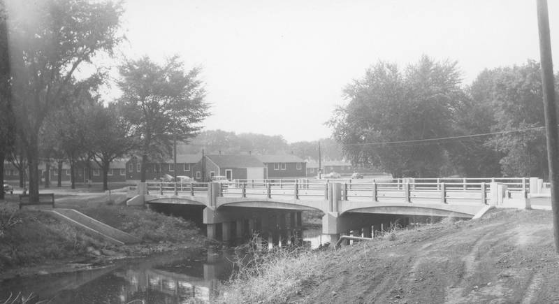 The then newly completed Lucinda Avenue bridge, adjacent to the campus of the Northern Illinois State College (now NIU), looking northwest in 1955.
