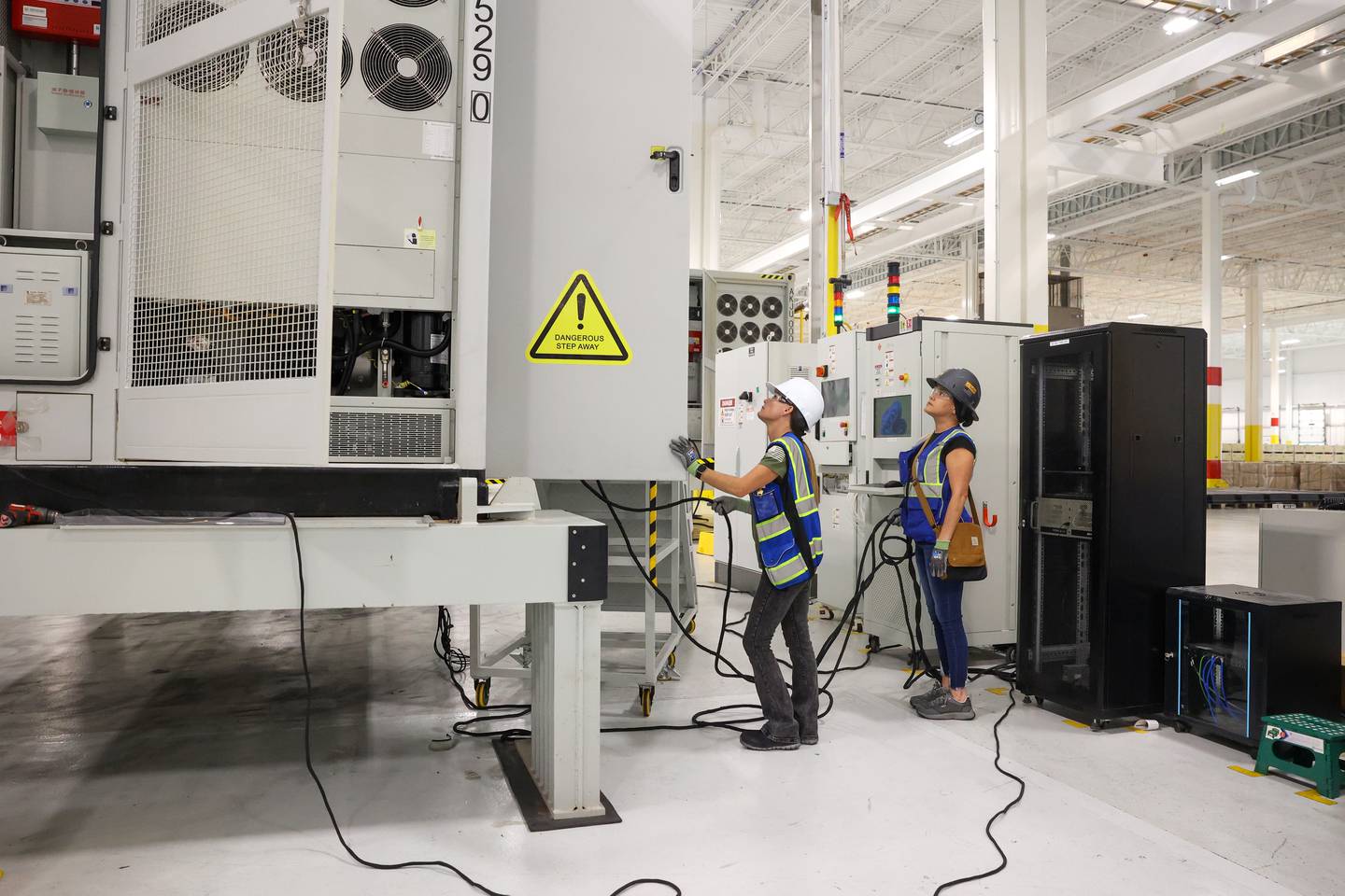 Workers prepare an energy-storage unit at Gotion Illinois in Manteno on Oct. 1, 2025. About 25% of the workforce at the battery manufacturing plant is female, according to Gotion's Public Relations staffer Andy Wheeler.