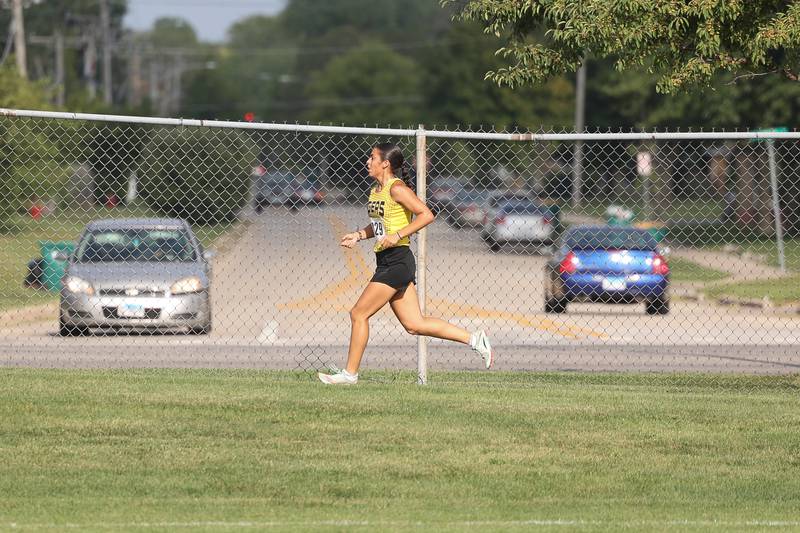 Joliet West’s Ganellisa Oceguera runs along North Larkin Avenue in the Joliet West Cross Country Dual Meet against Joliet Central on Monday, Aug. 28, 2023 in Joliet.