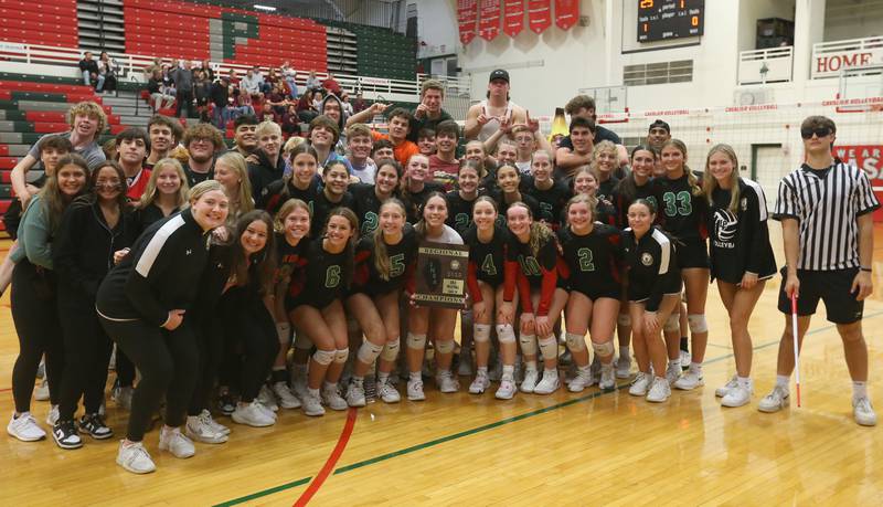 Members of the L-P volleyball team pose with the Class 3A Regional plaque and super fans after defeating Morris on Thursday, Oct. 26, 2023 at Sellett Gymnasium.