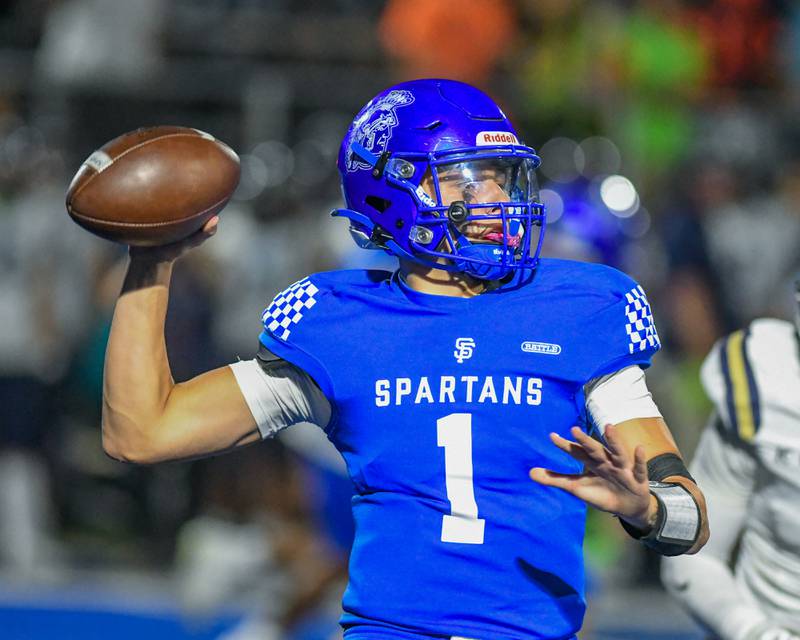 St. Francis's Brock Phillip (1) throws the ball during the game on Friday Oct. 3, 2025, while taking on IC Catholic Prep.