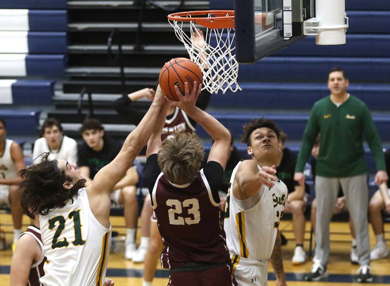 Crystal Lake South's Michael Prokos fouls Wheaton Academy's Hayden Schroeder as he shoots the ball during the IHSA Class 3A Cary-Grove Boys Basketball Regional Championship game on Friday, Feb. 23, 2024 at Cary-Grove High School.