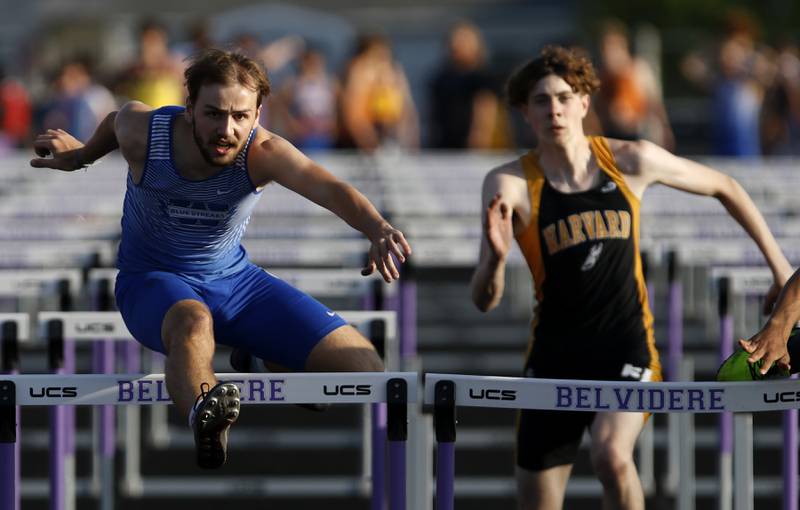 Woodstock’s Jared Kniola and Harvard’s Benard Bahnsen compete in the 110 hurdles during the IHSA Class 2A Belvidere Boys Track and Field Sectional Thursday, May 19, 2022, at Belvidere High School.