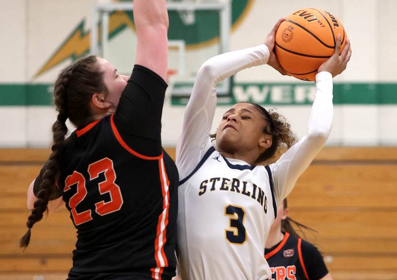 Sterling's Delali Amankwa goes to the basket against Crystal Lake Central's Leah Spychala during their Class 3A sectional semifinal game Tuesday, Feb. 25, 2025, at Boylan Catholic High School in Rockford.
