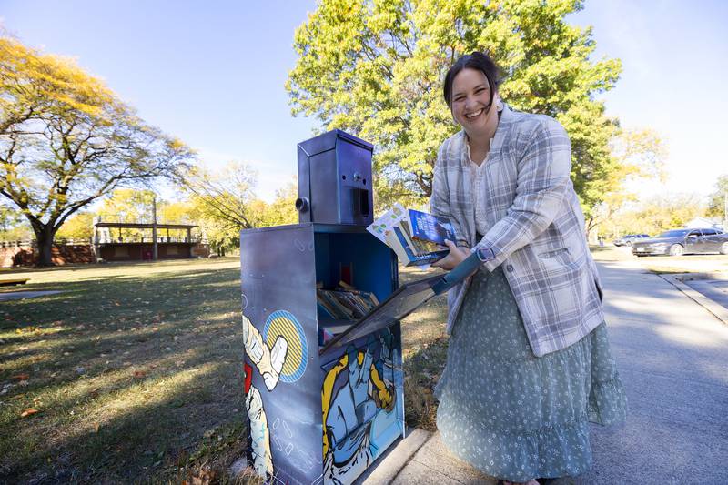 United Way of Lee County Executive Director Ashley Richter delivers some books to a little library Wednesday, Oct. 16, 2024, at Vaile Park in Dixon.