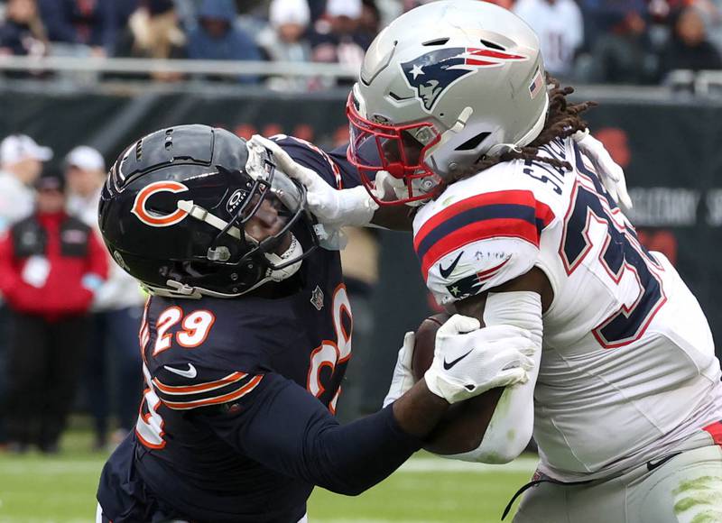 Chicago Bears cornerback Tyrique Stevenson tries to bring down New England Patriots running back Rhamondre Stevenson during their game Sunday, Nov. 10, 2024, at Soldier Field in Chicago.