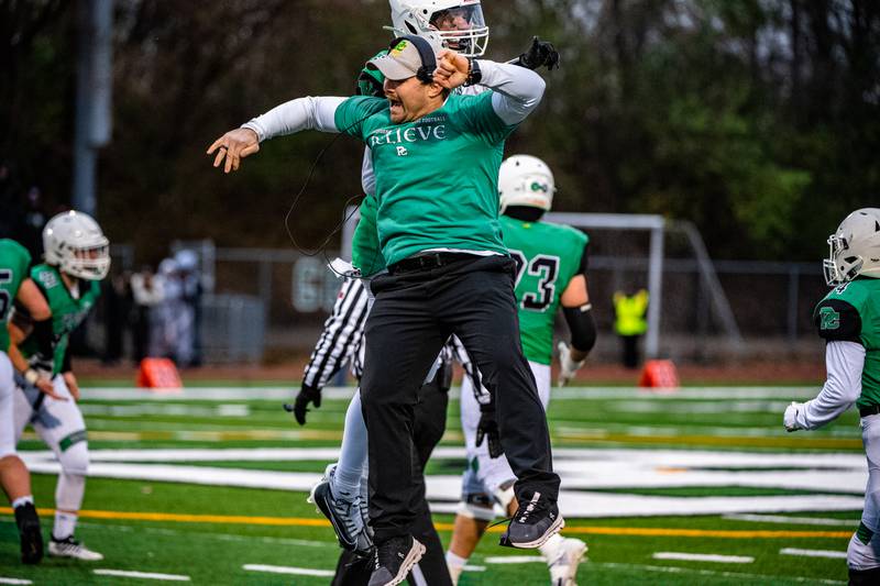 Providence Catholic's Gavin Hagan and head coach Tyler Plantz celebrate during the third-round Class 4A playoff game against Richmond-Burton in New Lenox.