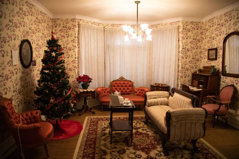 The living room in the 1892 Blodgett House decorated for Christmas during Downers Grove Museum's Merry & Bright: A Victorian Christmas event on Saturday, Dec. 10, 2022.