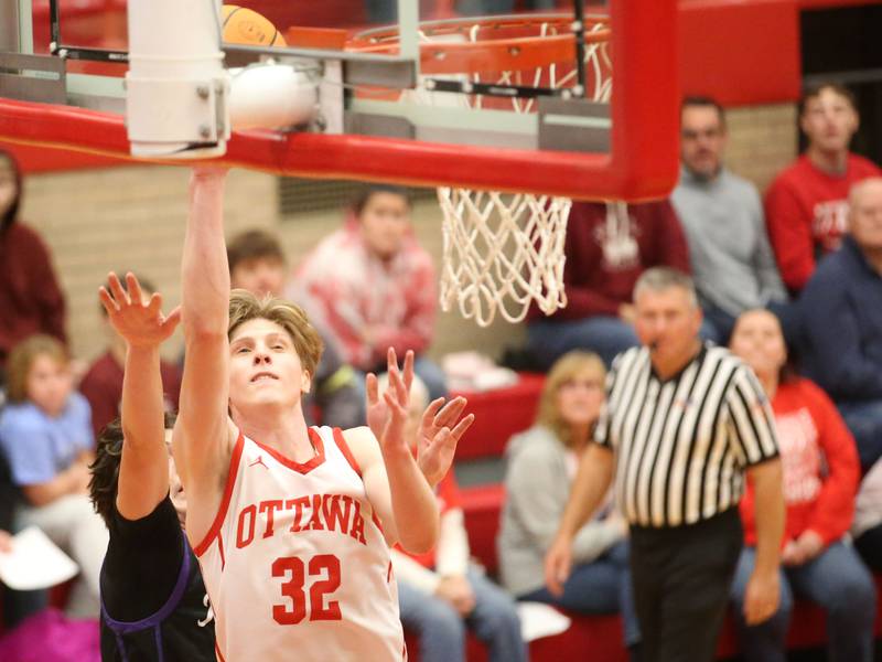 Ottawa's Aric Threadgil eyes the hoop with a shot on Plano during the Dean Riley Shootin' The Rock Thanksgiving Tournament on Tuesday, Nov. 26, 2024 in Kingman Gym at Ottawa High School.